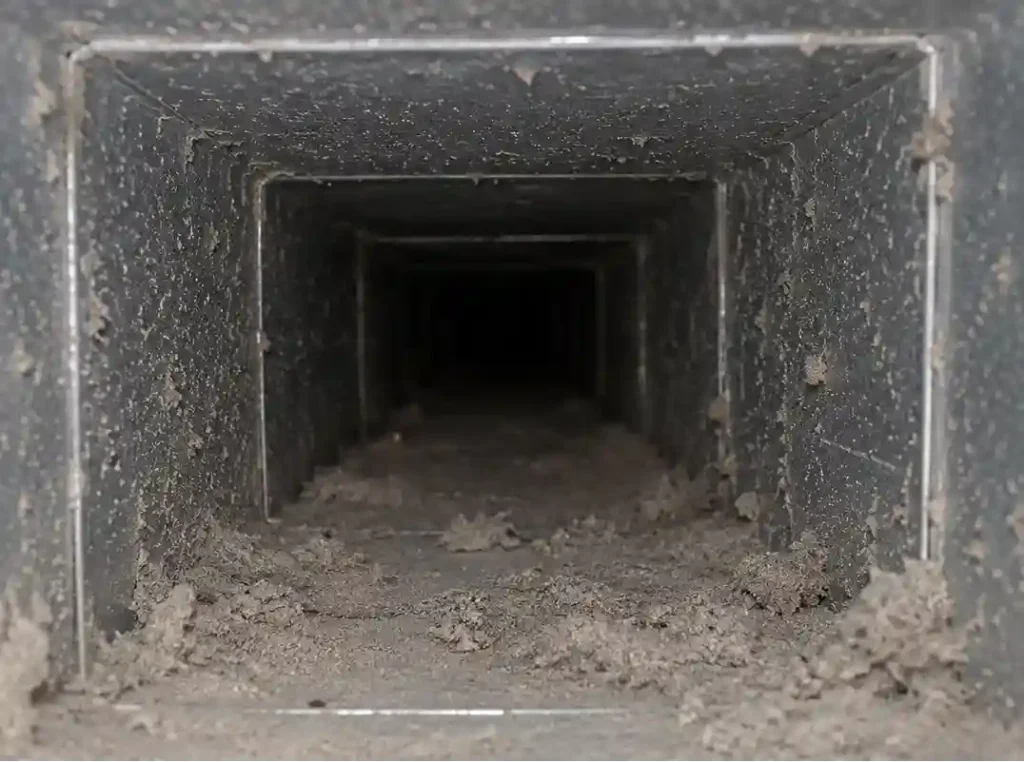 Dirty dust buildup inside residential HVAC air duct system
